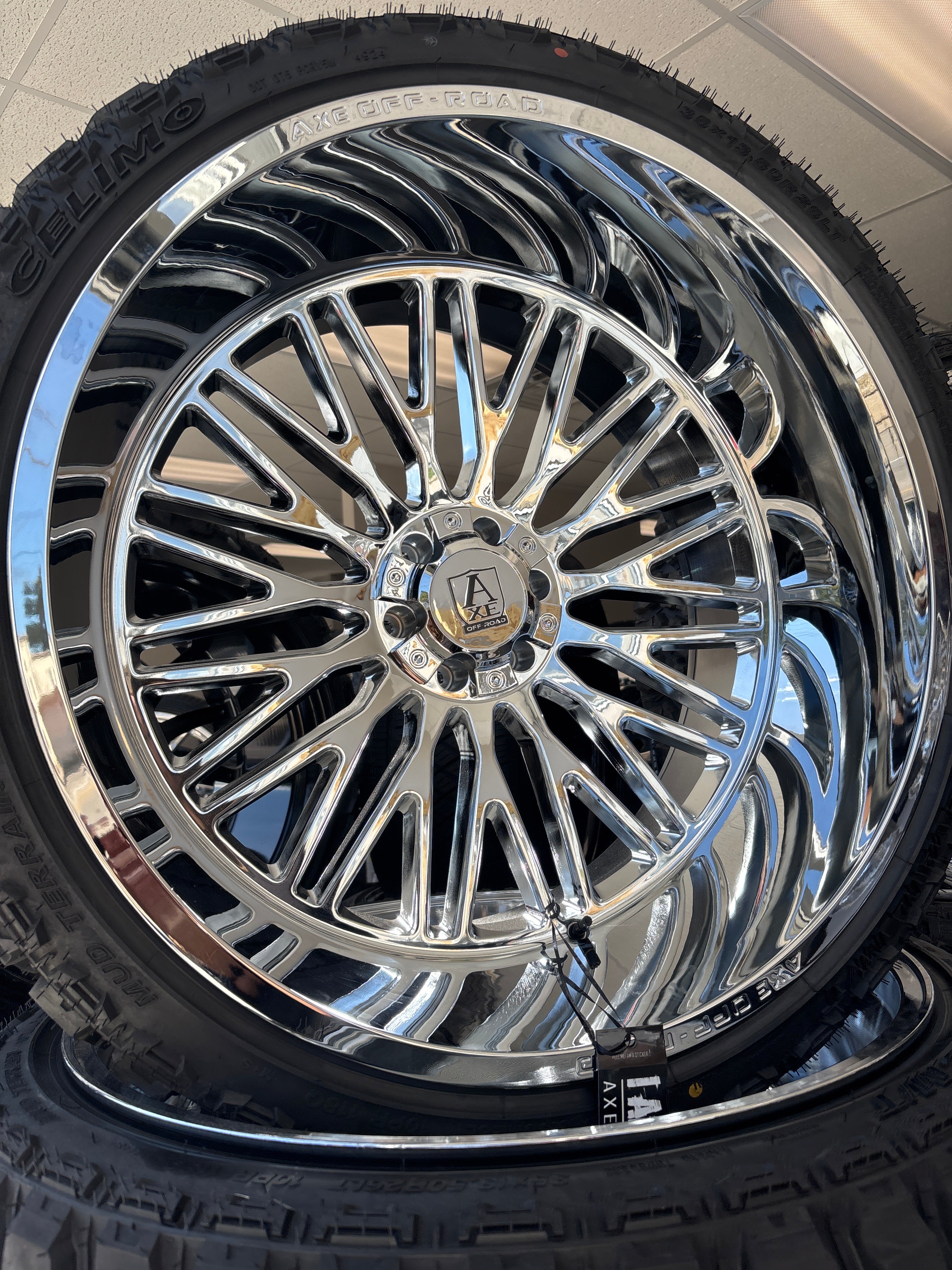 26x14 Axe Kratos Chrome 6x5.5/ 6x135 & 35x13.50R26 Celimo MT