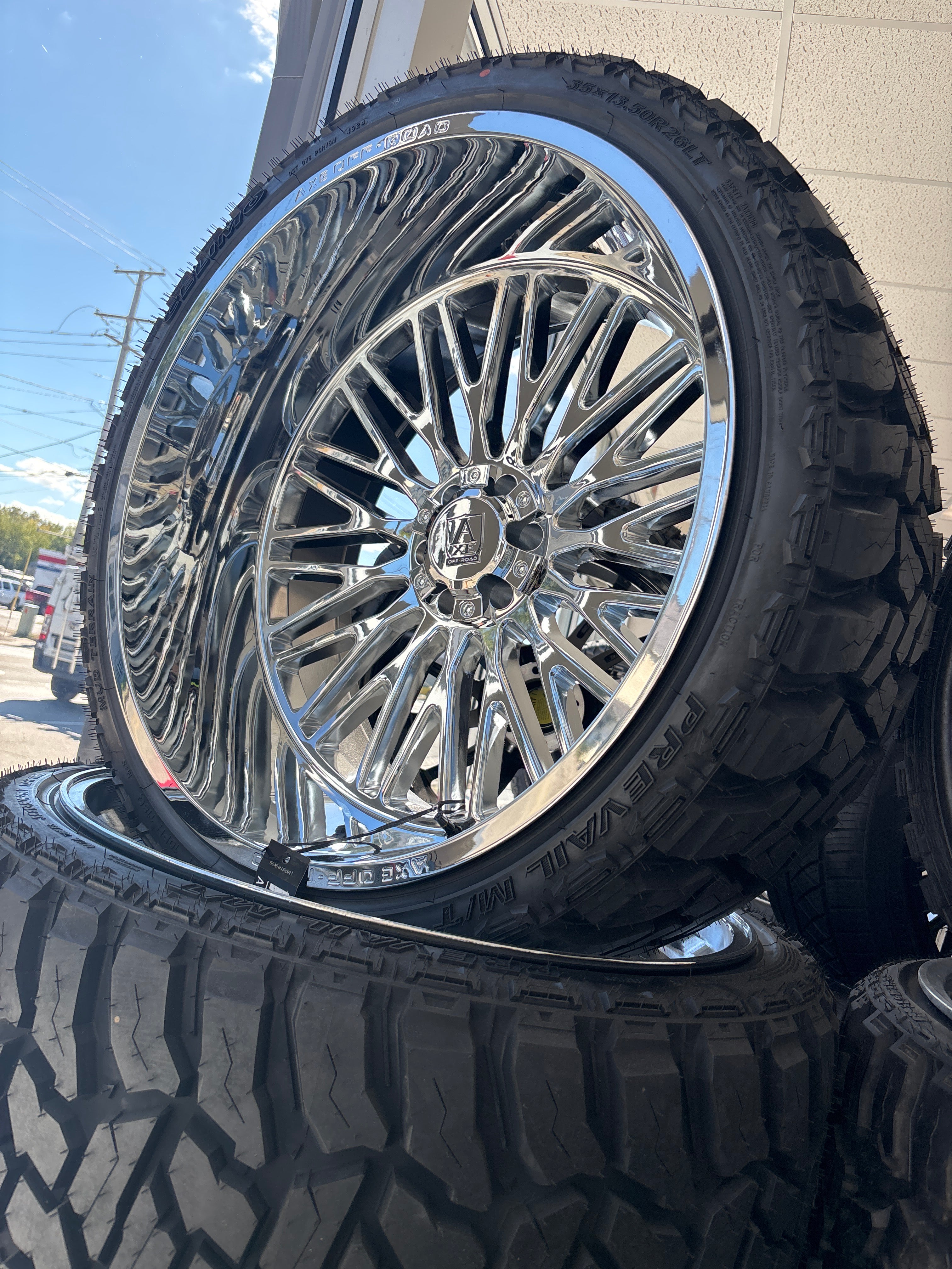 26x14 Axe Kratos Chrome 6x5.5/ 6x135 & 35x13.50R26 Celimo MT