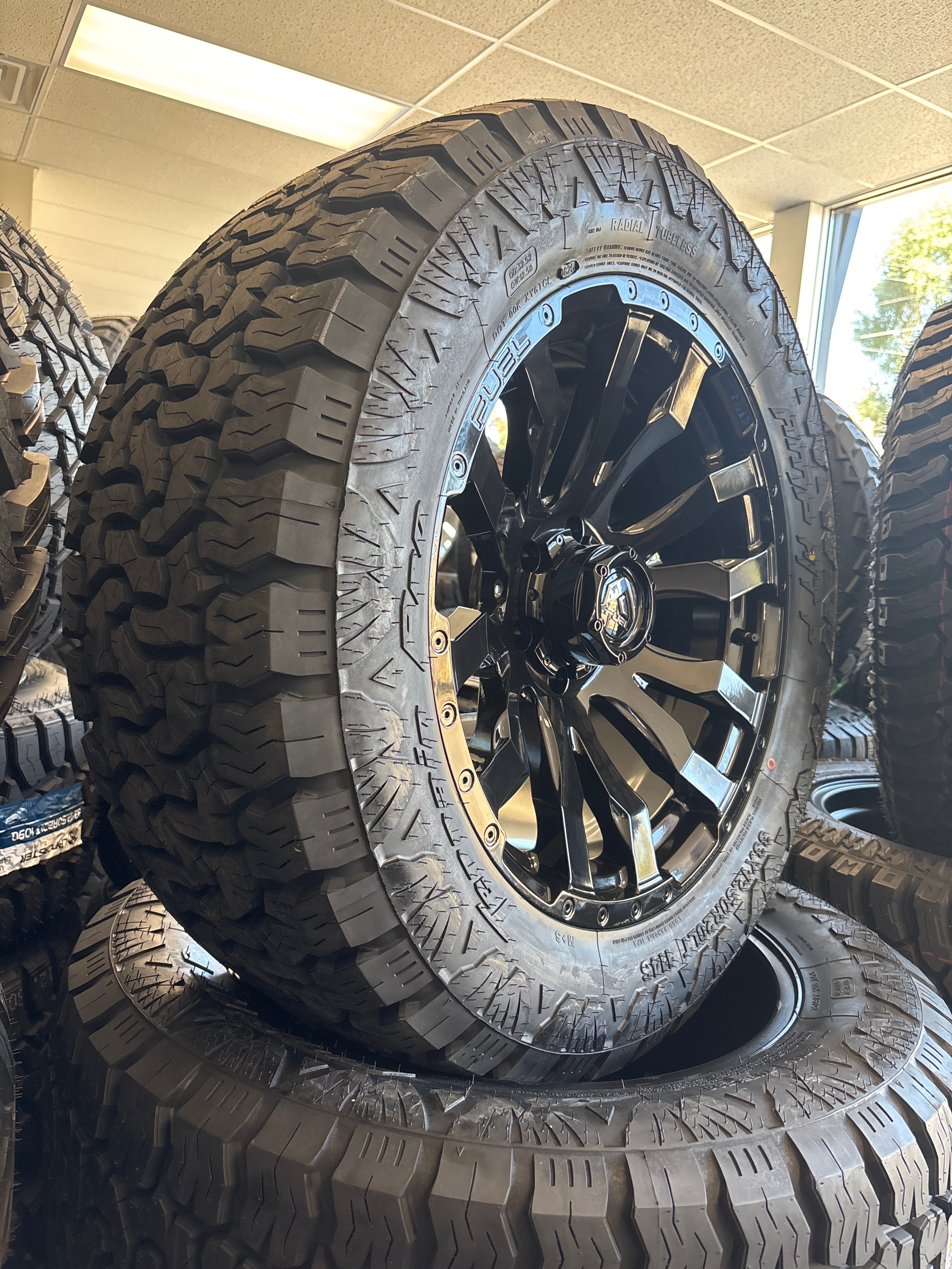 20x9 Fuel Blitz 6x5.5 & 33x12.50R20 AMP A/T Pro