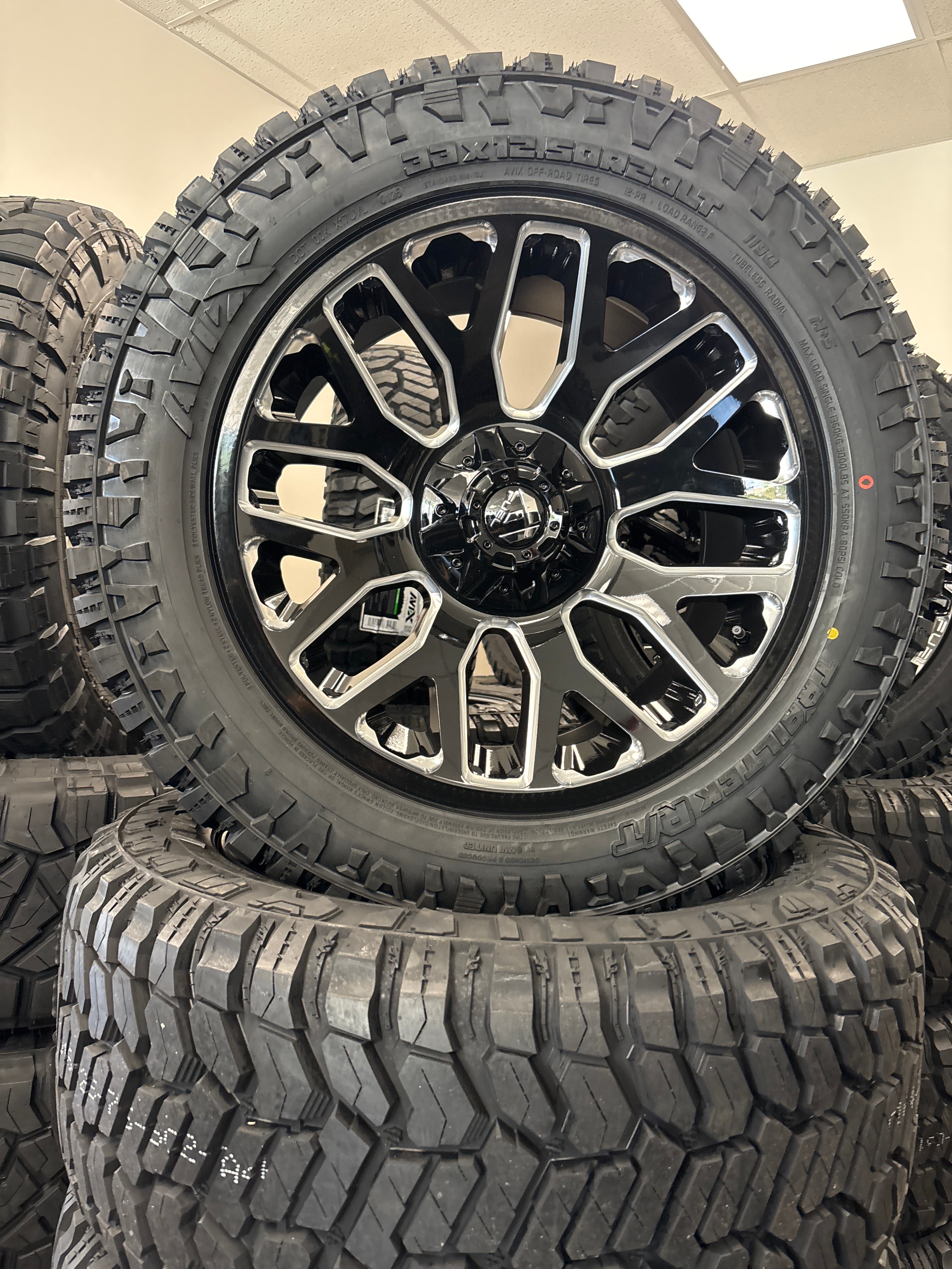 20x10 Fuel Warrior GBM 6x5.5/ 6x135 & 33x12.50R20 Avix R/T