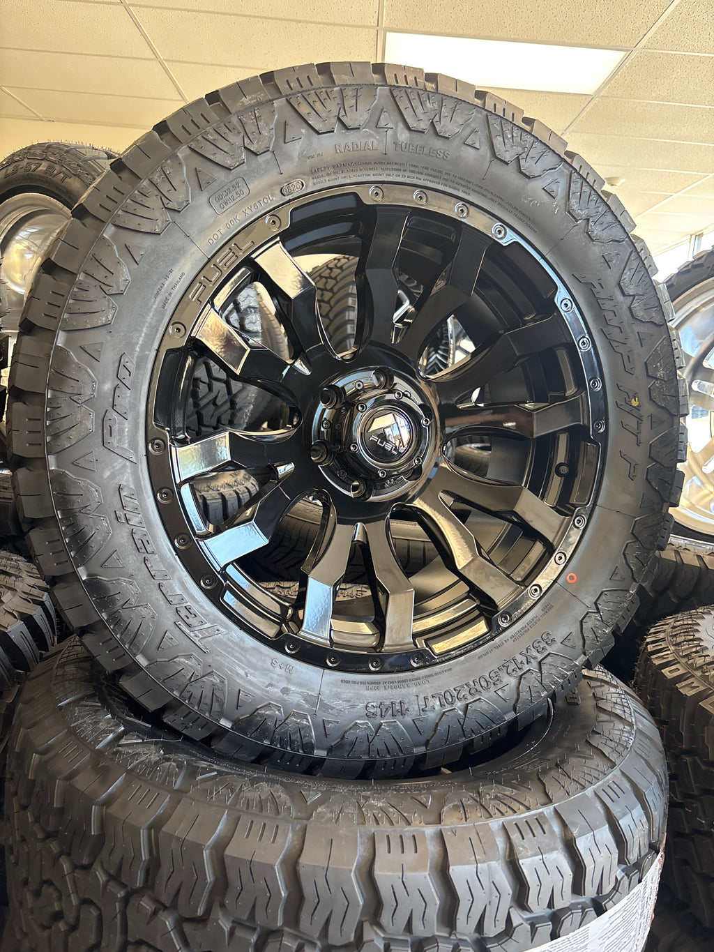 20x9 Fuel Blitz 6x5.5 & 33x12.50R20 AMP A/T Pro