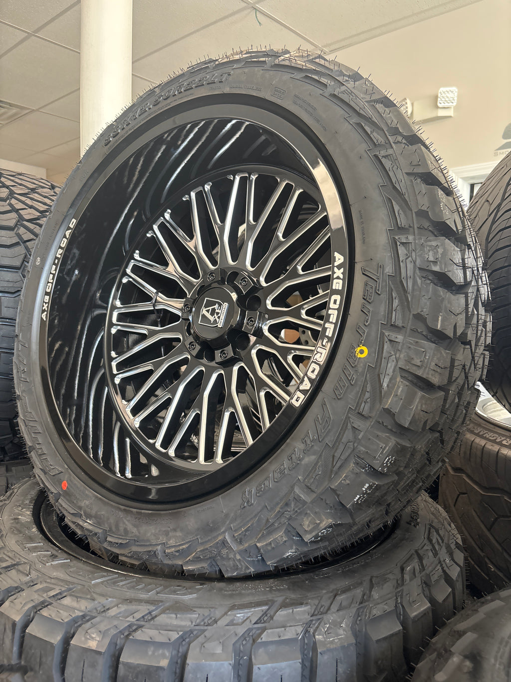 22x12 Axe Kratos GBM 6x5.5/ 6x135 & 33x12.50R22 AMP R/T