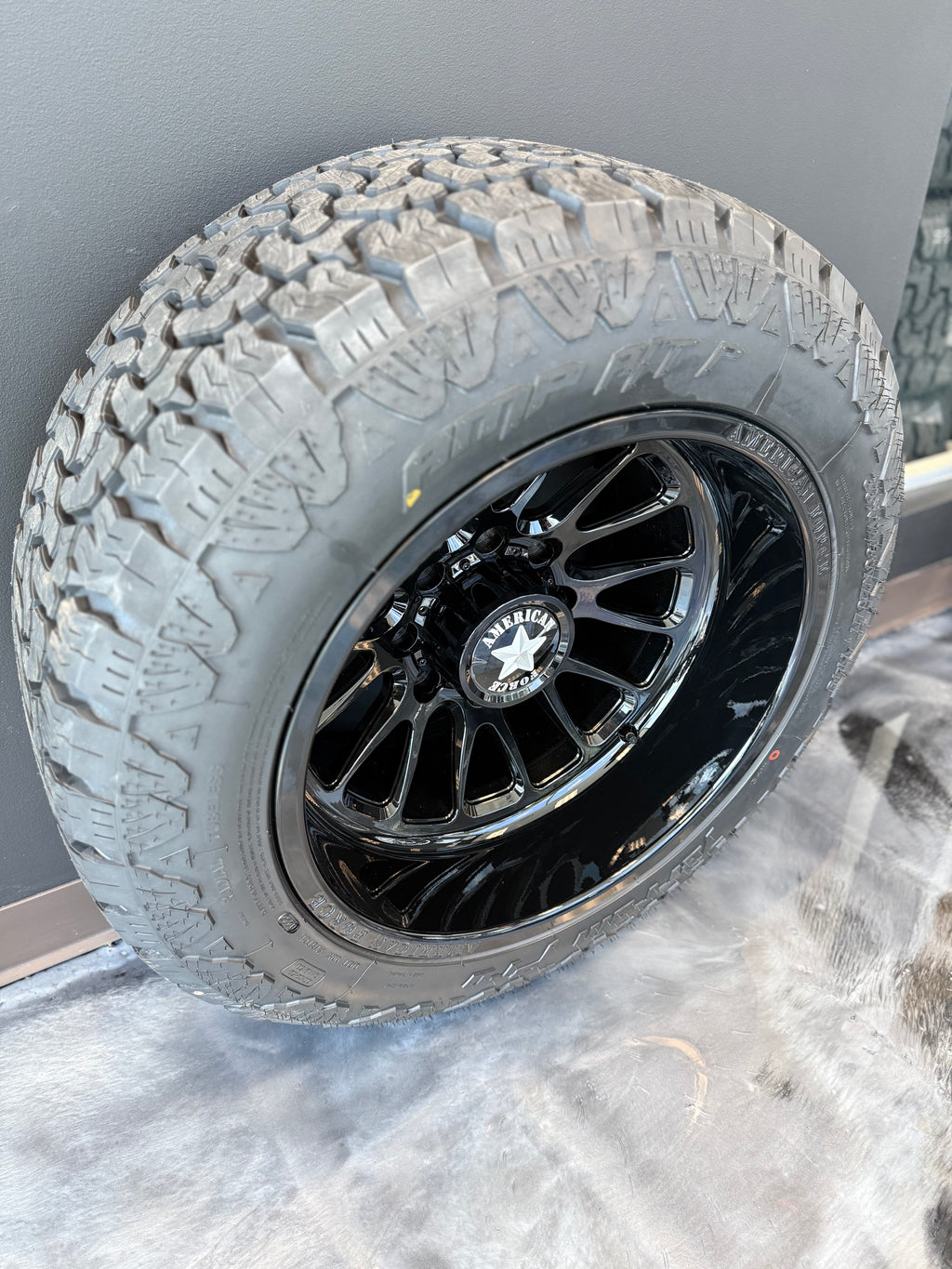 20x12 American Force Nemesis CC Gloss Black 8x180 & 33x12.50R20 AMP AT PRO - Blowout