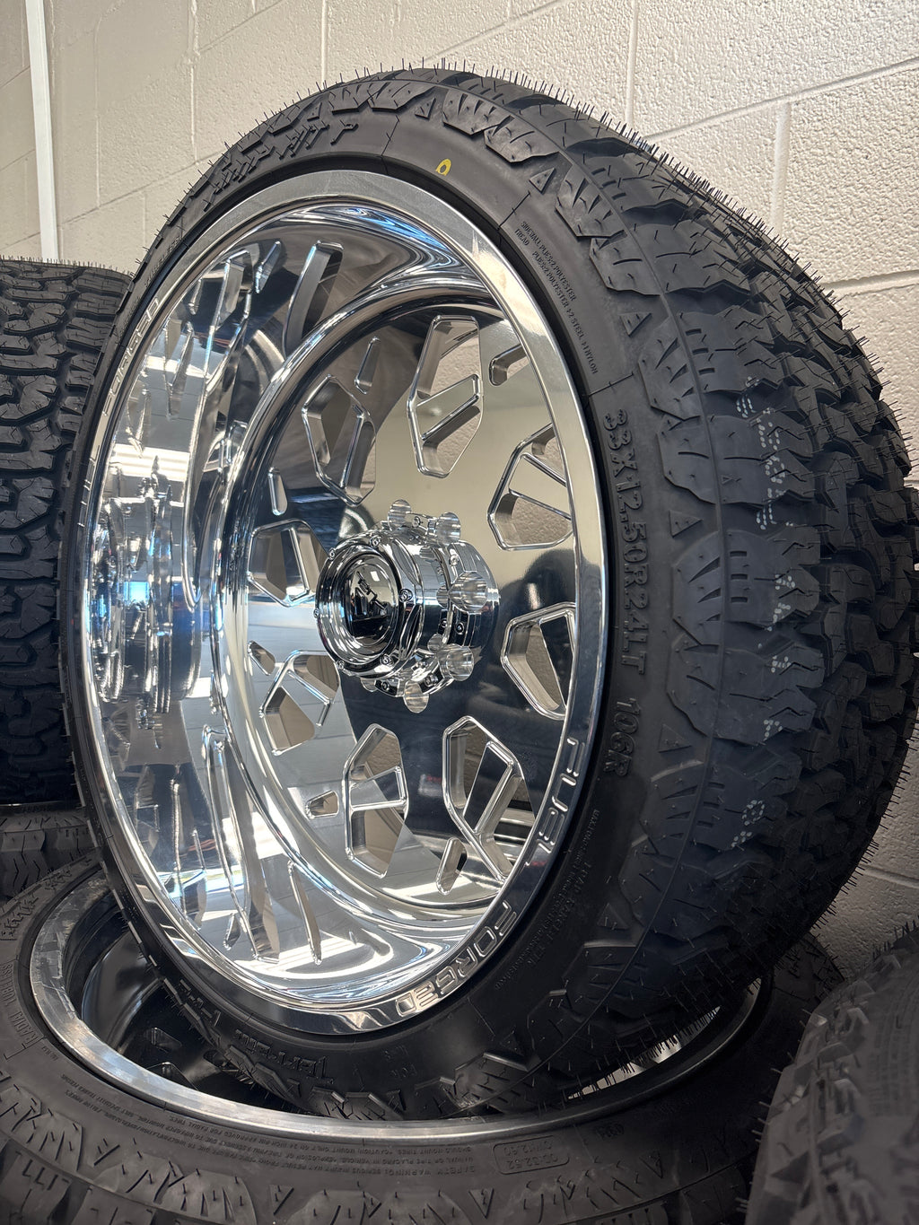 4 - 24x12 Fuel Forged FF111 Polished 8x6.5 & 33x12.50R24 AMP A/T Pro