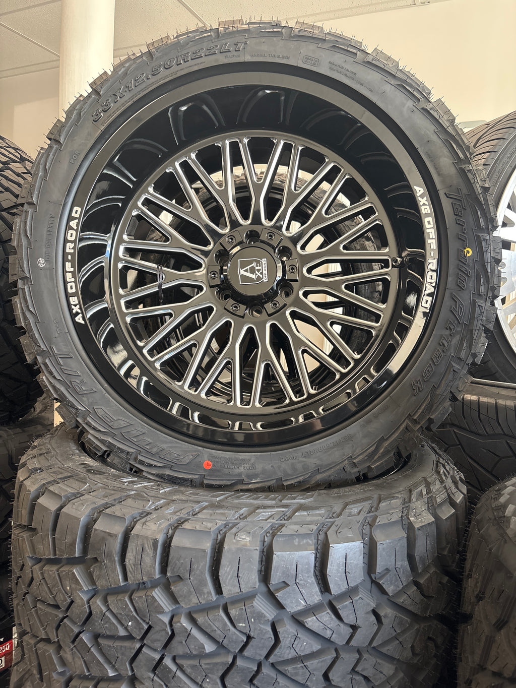 22x12 Axe Kratos GBM 6x5.5/ 6x135 & 33x12.50R22 AMP R/T