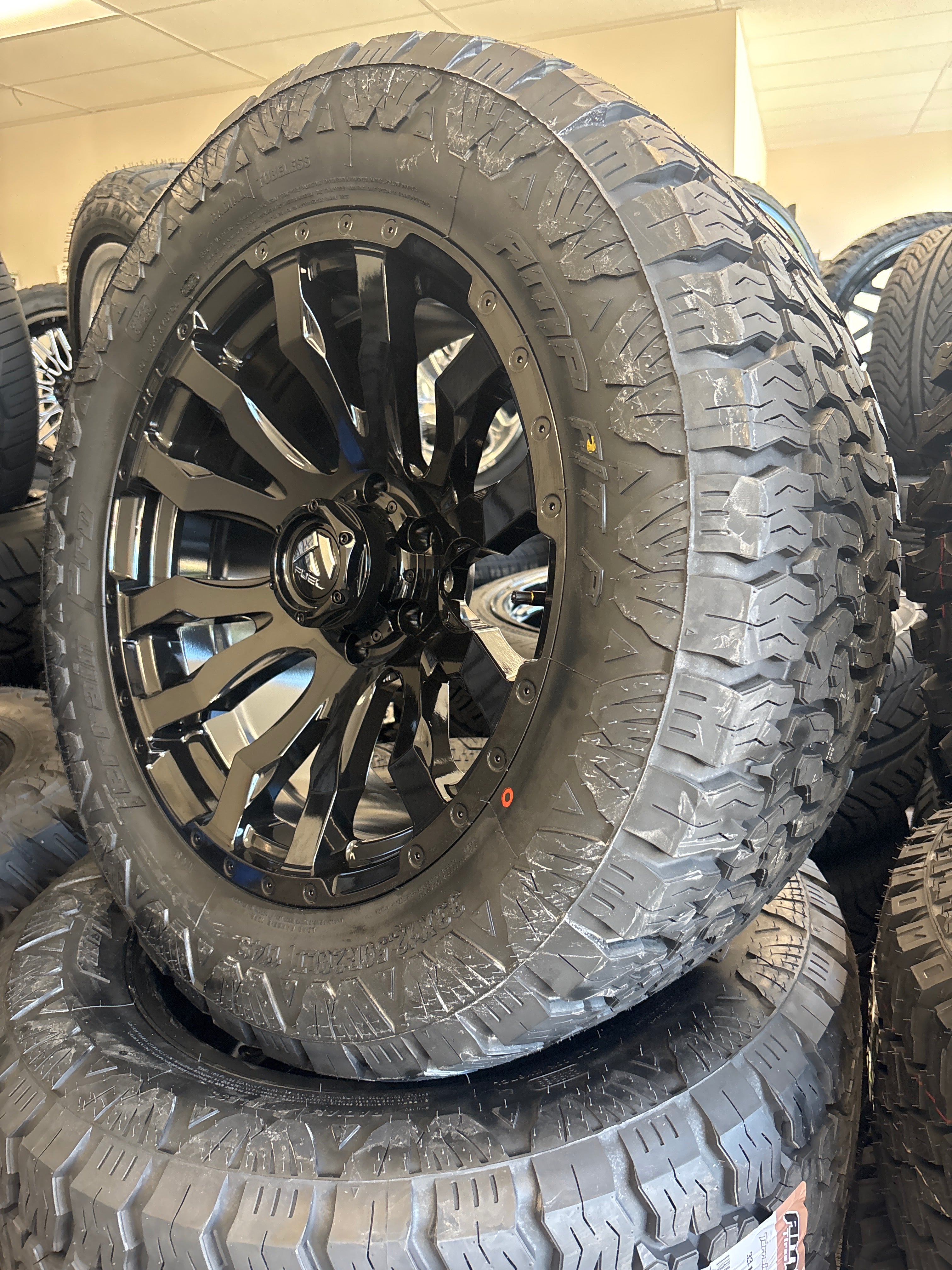 20x9 Fuel Blitz 6x5.5 & 33x12.50R20 AMP A/T Pro