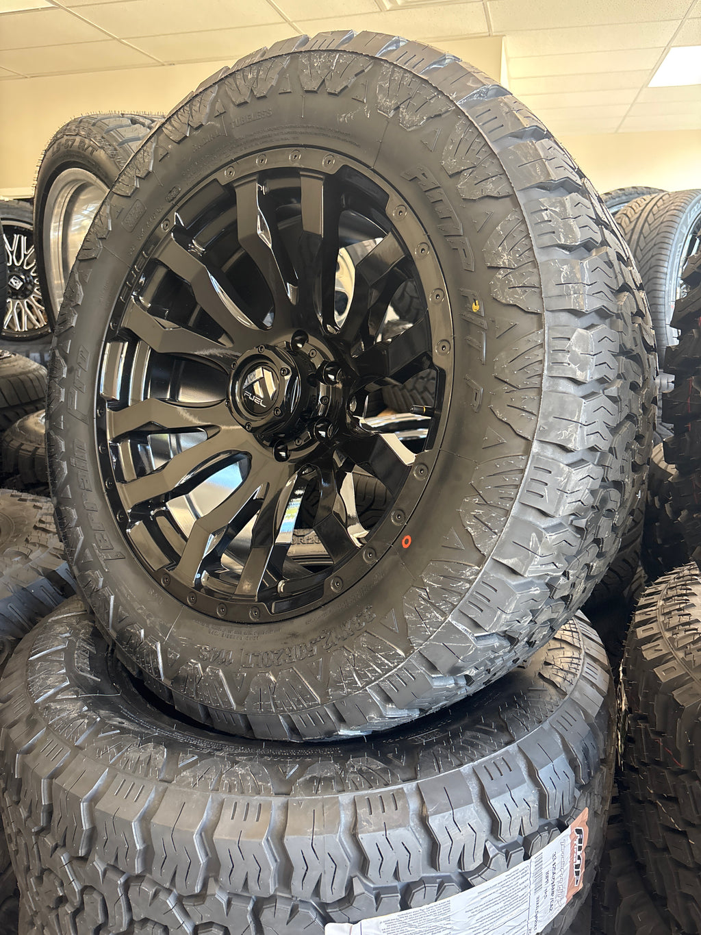 20x9 Fuel Blitz 6x5.5 & 33x12.50R20 AMP A/T Pro